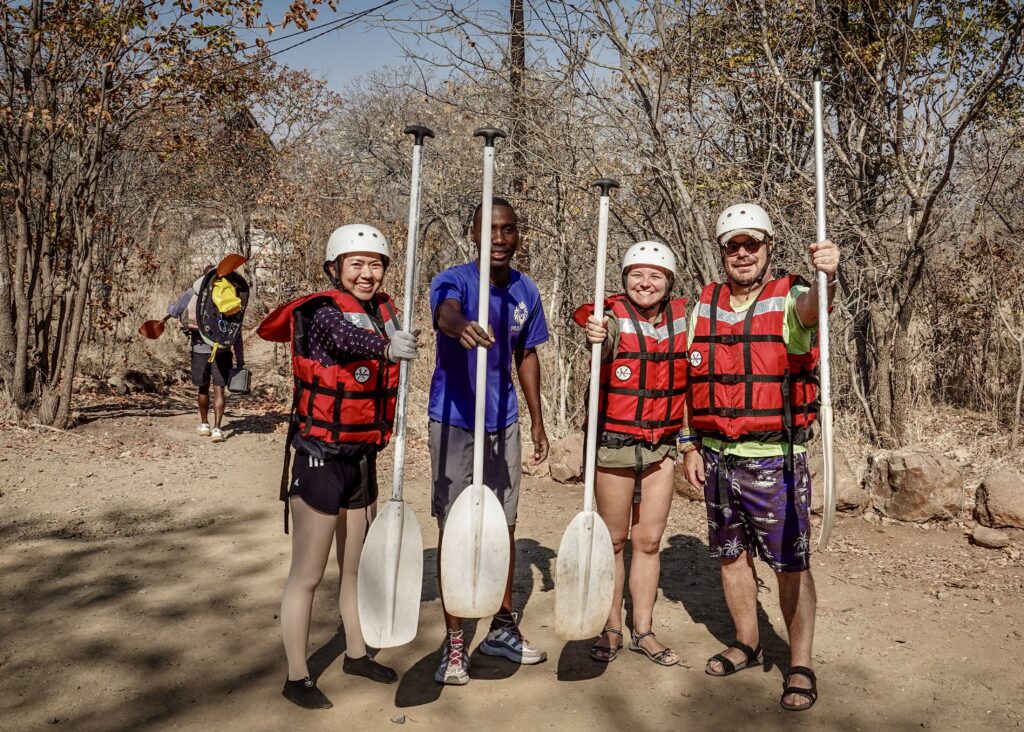 Our rafting group, paddles in hand.