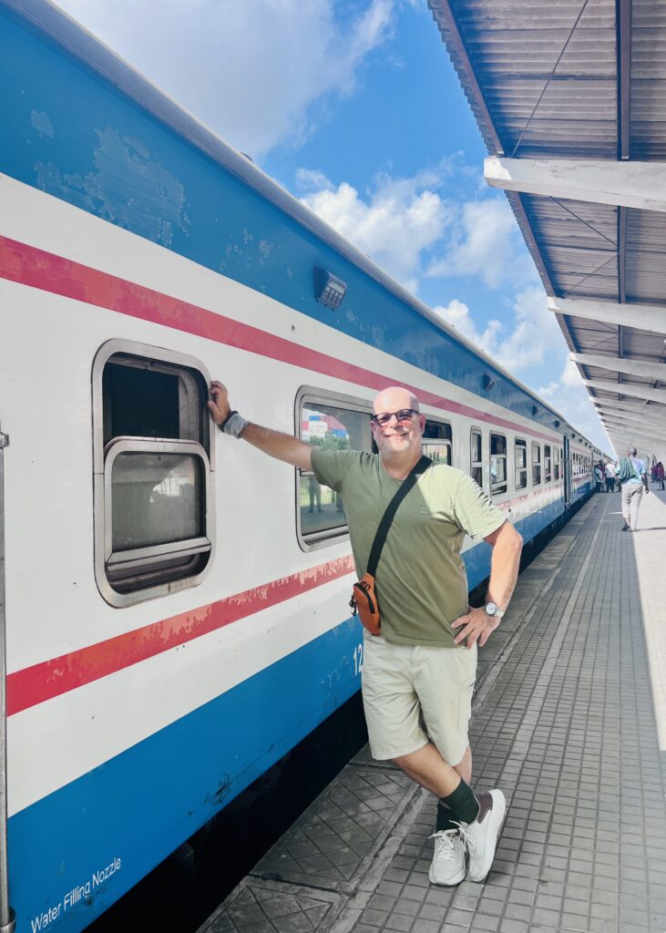 Me beside the TAZARA train before departure at Dar es Salaam.