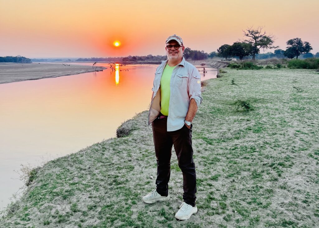 Sunset in South Luangwa National Park, Zambia, as the light fades over the Luangwa River valley at the end of a day on safari.